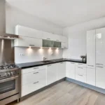 Kitchen in White at Westshore Apartments Mount Mary Bandra